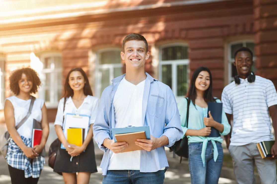 Young Adults Posing Outdoors in Their University Campus